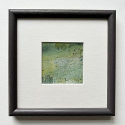 The Bolthole mounted and framed in dark grey wooden frame