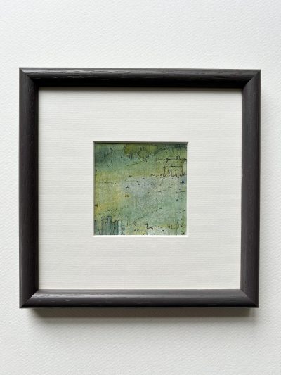 The Bolthole mounted and framed in dark grey wooden frame